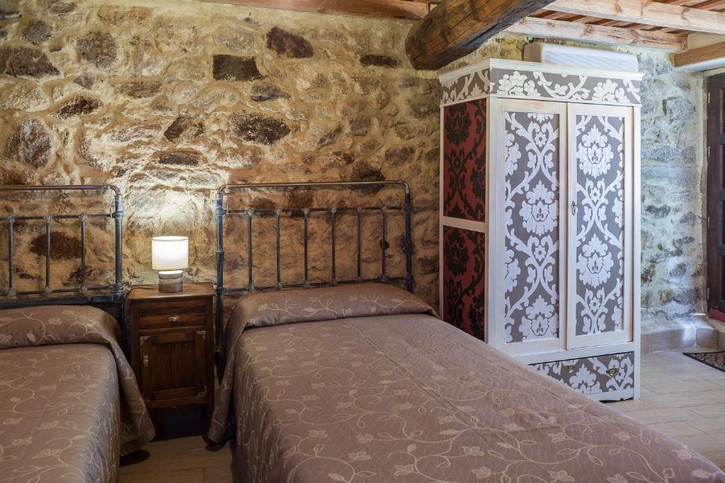 Postel nebo postele na pokoji v ubytování Casa Rural La Barquilla