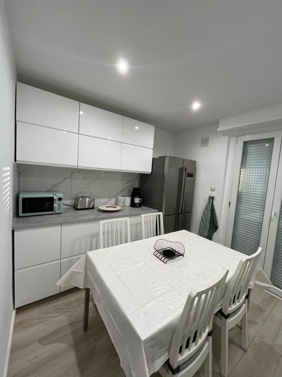 Kuchyň nebo kuchyňský kout v ubytování Flori'Home