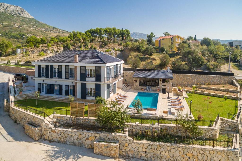 an aerial view of a house with a pool at Villa Zvonimir in Klis