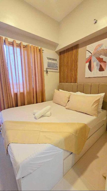 Postel nebo postele na pokoji v ubytování JeeCee Homes in Mactan Lapu-Lapu Cebu