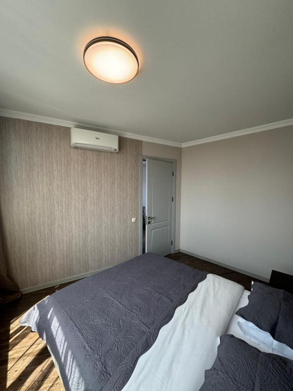 Postel nebo postele na pokoji v ubytování Pirosmani Mini Hotel