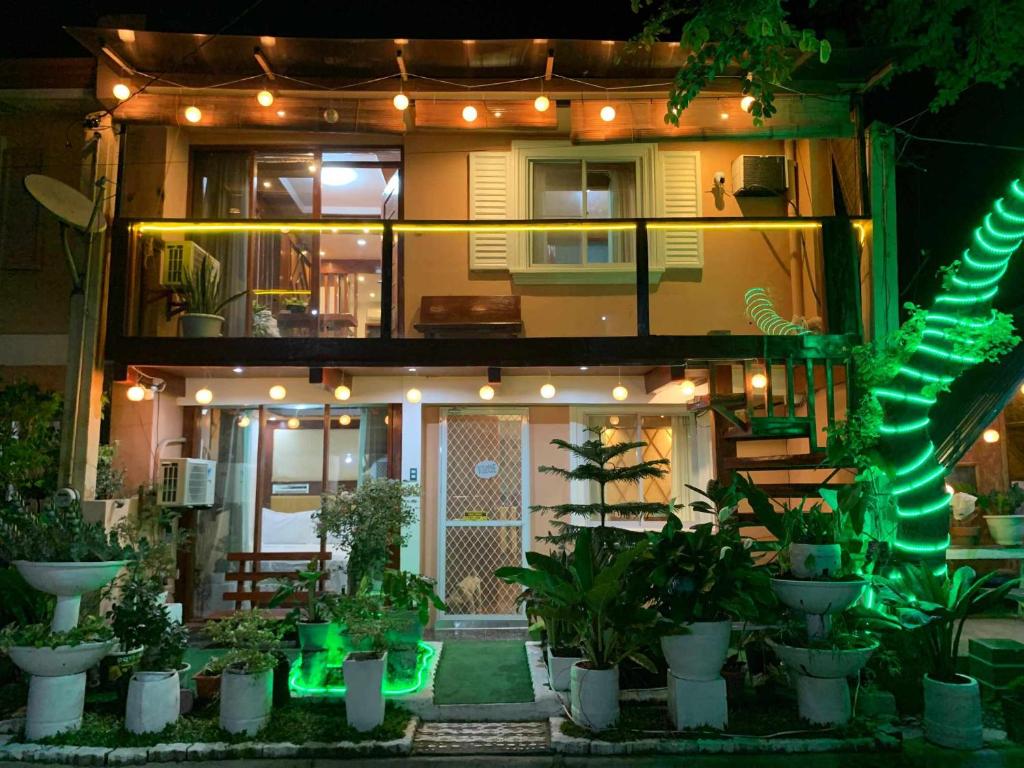 a house with a lot of plants in front of it at Tagum Mini Hotel By Tripleview residences in Tagum