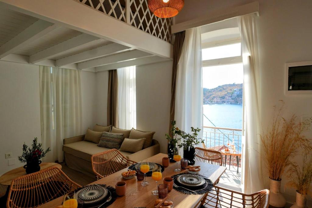 a living room with a couch and a table at Bella Vista in Symi