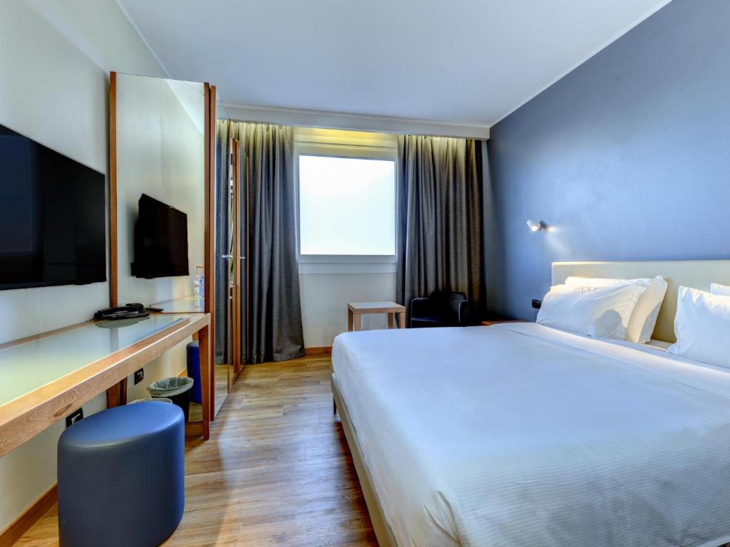 Postel nebo postele na pokoji v ubytování B&B Hotel Quarto d'Altino