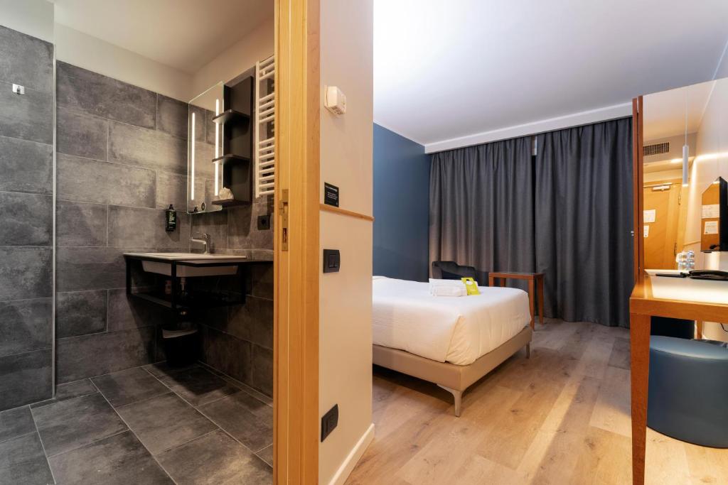 Postel nebo postele na pokoji v ubytování B&B Hotel Quarto d'Altino