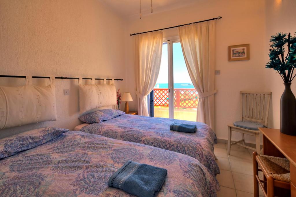 Postel nebo postele na pokoji v ubytování Apollo Beach Villa 63