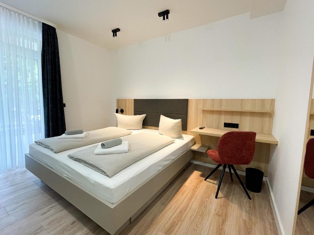 Postel nebo postele na pokoji v ubytování HOLI City Apart Hotel Berlin