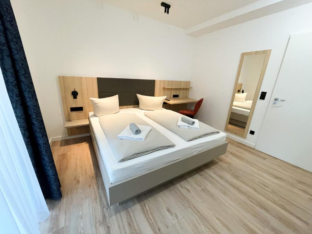 Postel nebo postele na pokoji v ubytování HOLI City Apart Hotel Berlin