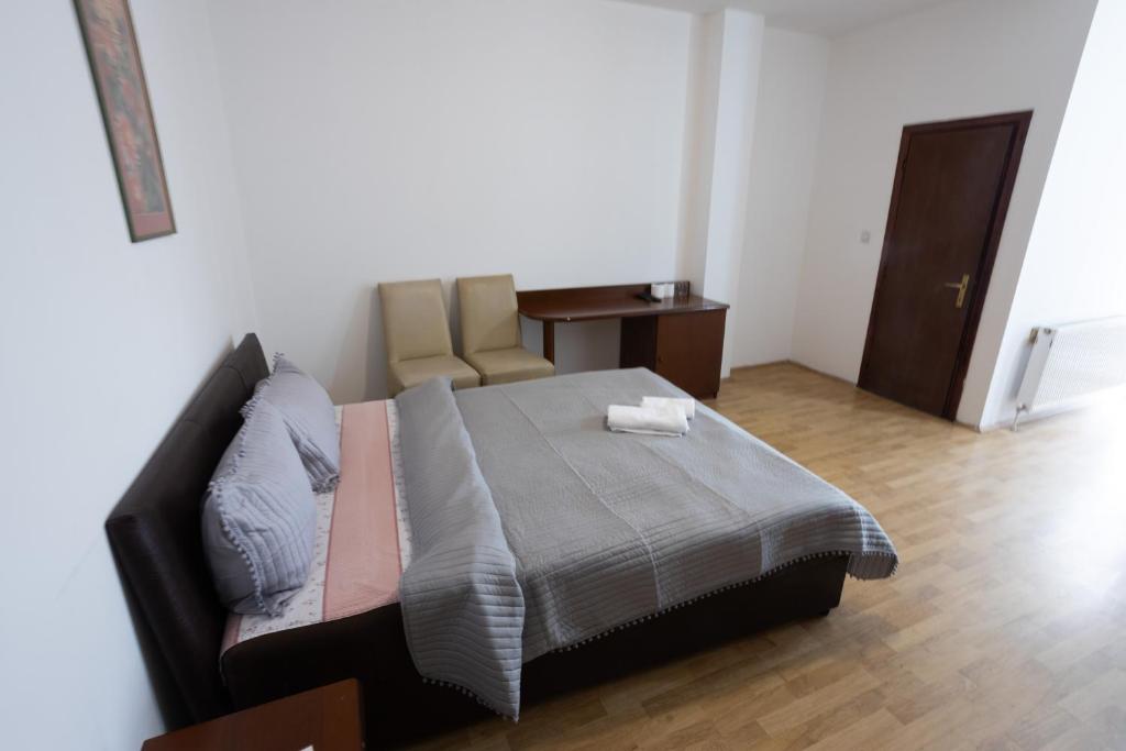 Postel nebo postele na pokoji v ubytování Garni Hotel Palma