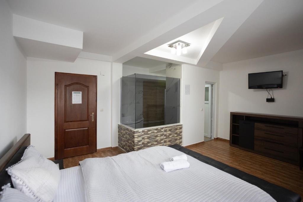 Postel nebo postele na pokoji v ubytování Garni Hotel Palma