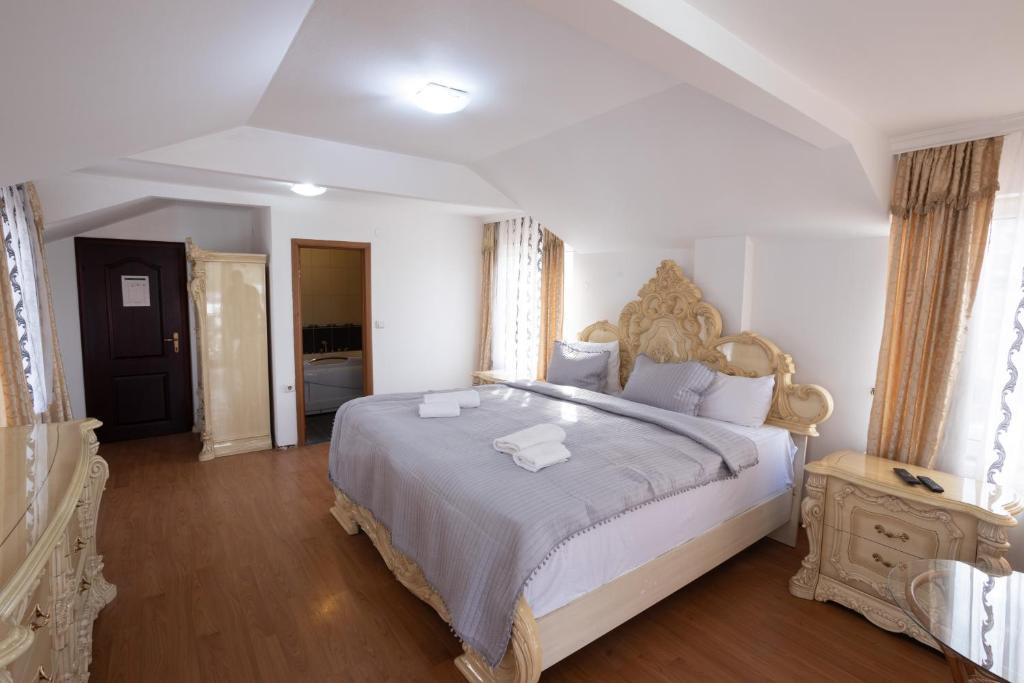 Postel nebo postele na pokoji v ubytování Garni Hotel Palma