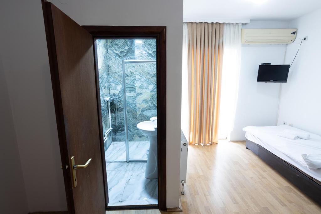 Postel nebo postele na pokoji v ubytování Garni Hotel Palma