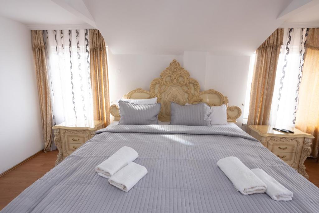 Postel nebo postele na pokoji v ubytování Garni Hotel Palma