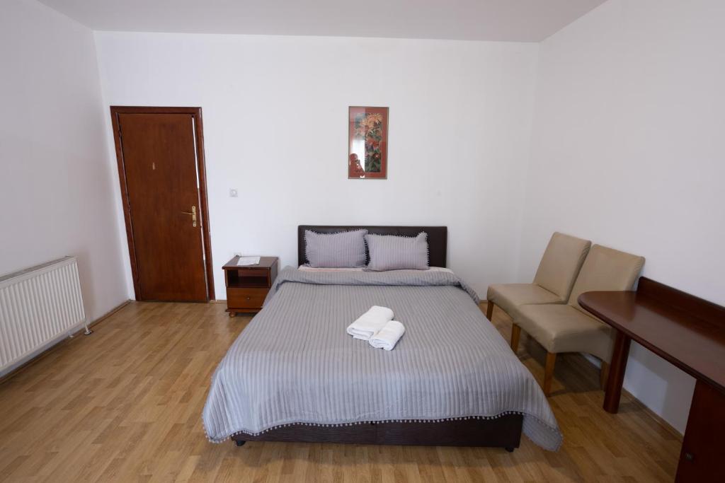 Postel nebo postele na pokoji v ubytování Garni Hotel Palma
