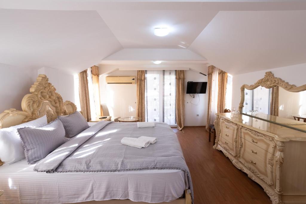 Postel nebo postele na pokoji v ubytování Garni Hotel Palma