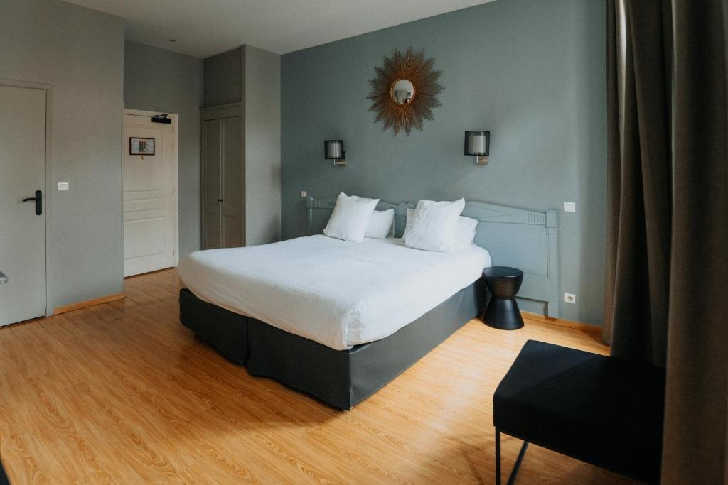 Postel nebo postele na pokoji v ubytování Hotel Albert 1er