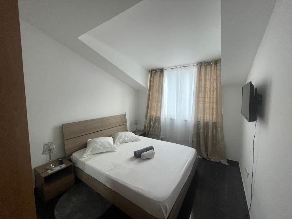 Postel nebo postele na pokoji v ubytování Chambre 3 Residencial Eunice