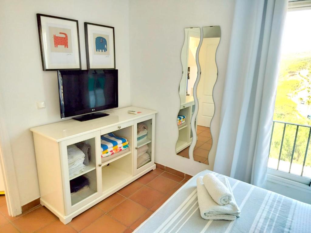 TV a/nebo společenská místnost v ubytování Bohemian Penthouse in Alcaidesa
