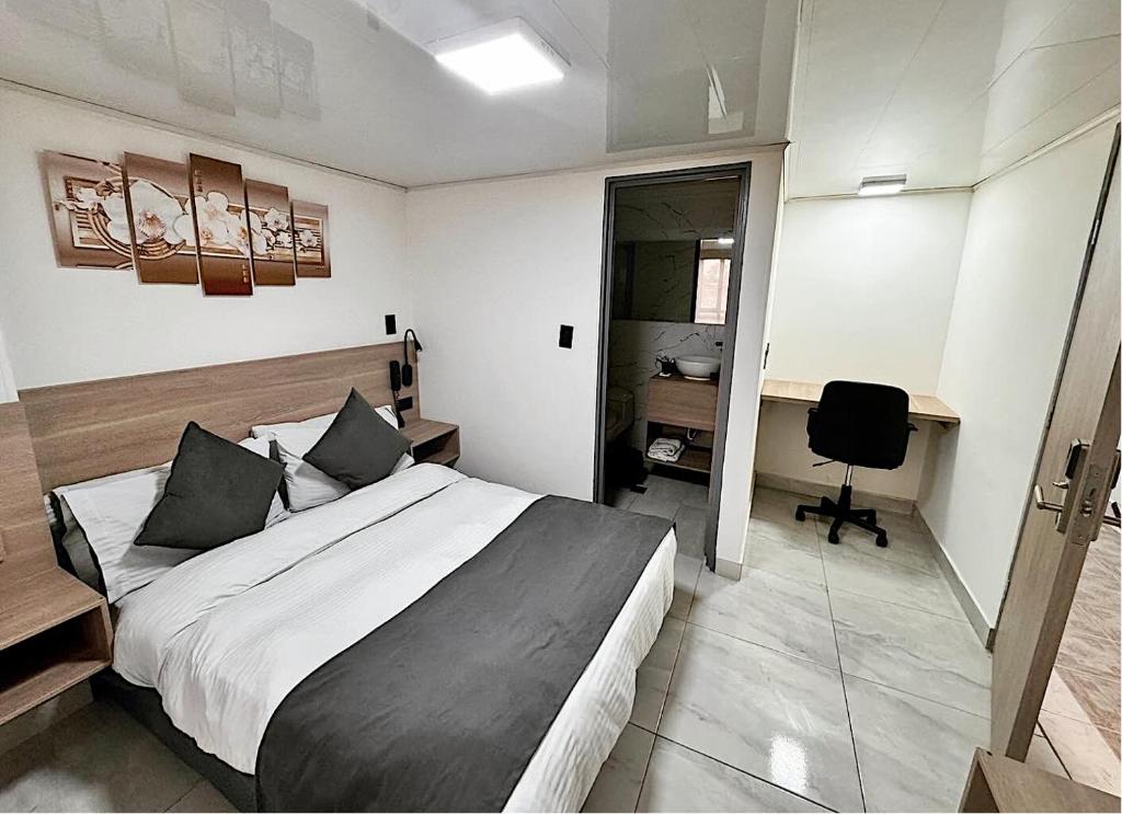 Postel nebo postele na pokoji v ubytování Hotel Fénix Real Bogotá