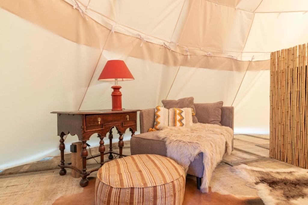 Voodi või voodid majutusasutuse Tipi Bo Deluxe toas