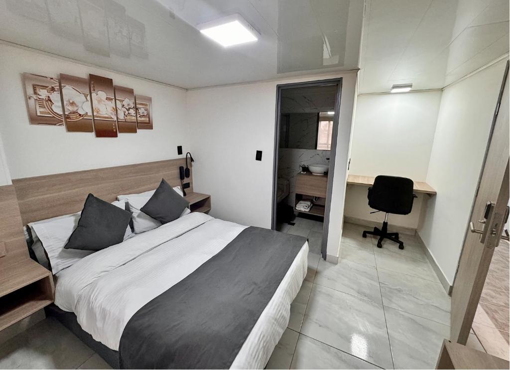 Postel nebo postele na pokoji v ubytování Hotel Fénix Real Bogotá