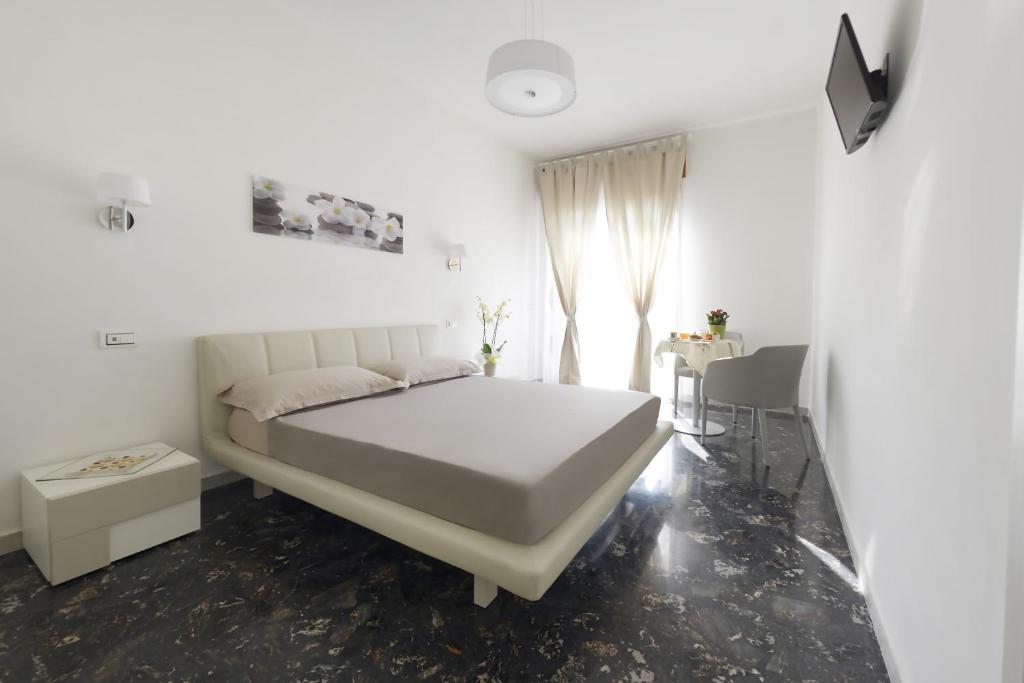 Łóżko lub łóżka w pokoju w obiekcie B&B La Vie en Rose