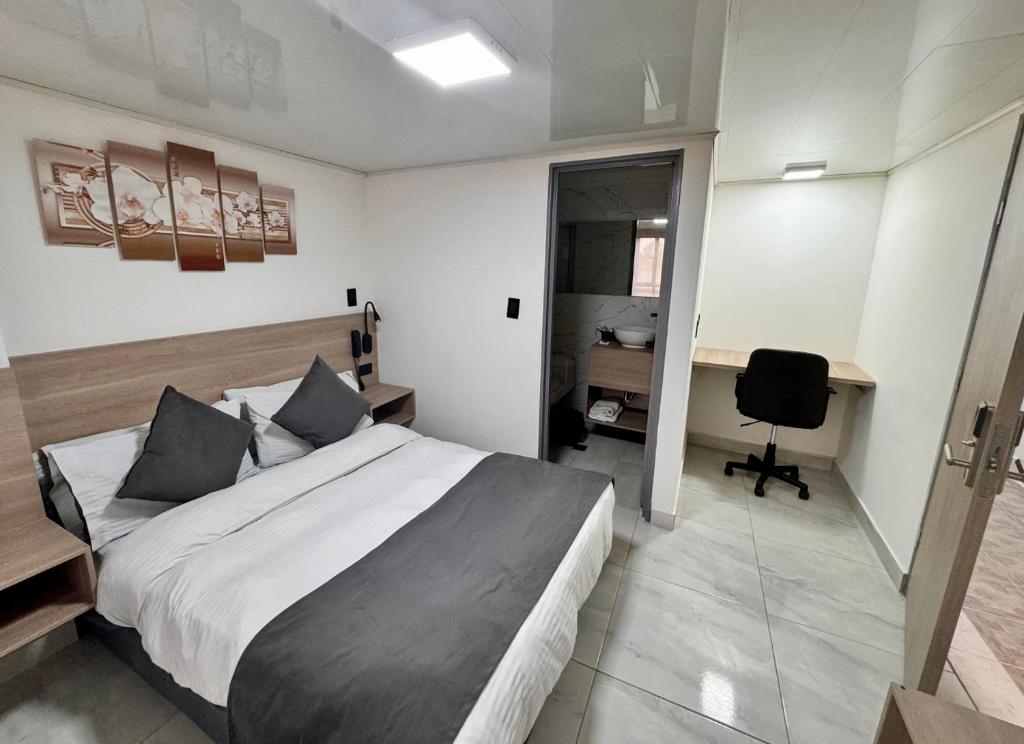 Postel nebo postele na pokoji v ubytování Hotel Fénix Real Bogotá