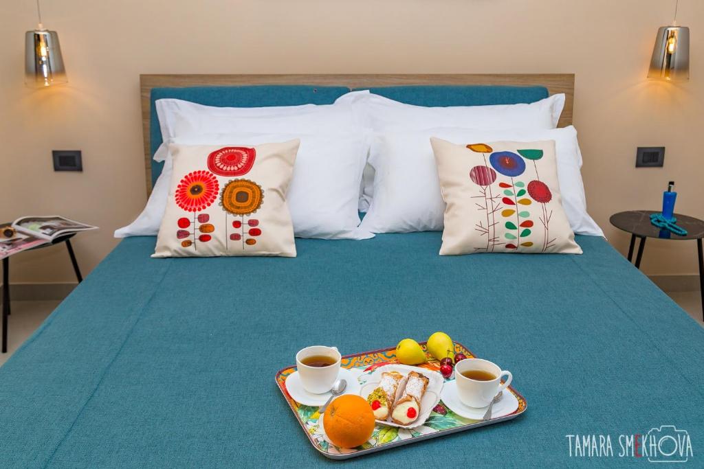 Postel nebo postele na pokoji v ubytování Macramè Fazello Rooms