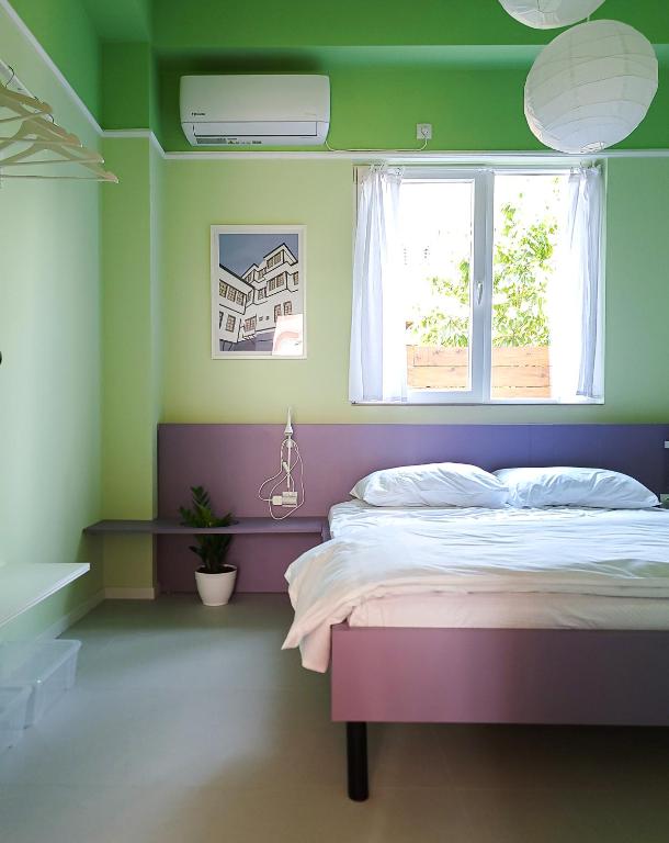 Postel nebo postele na pokoji v ubytování Iris Agata