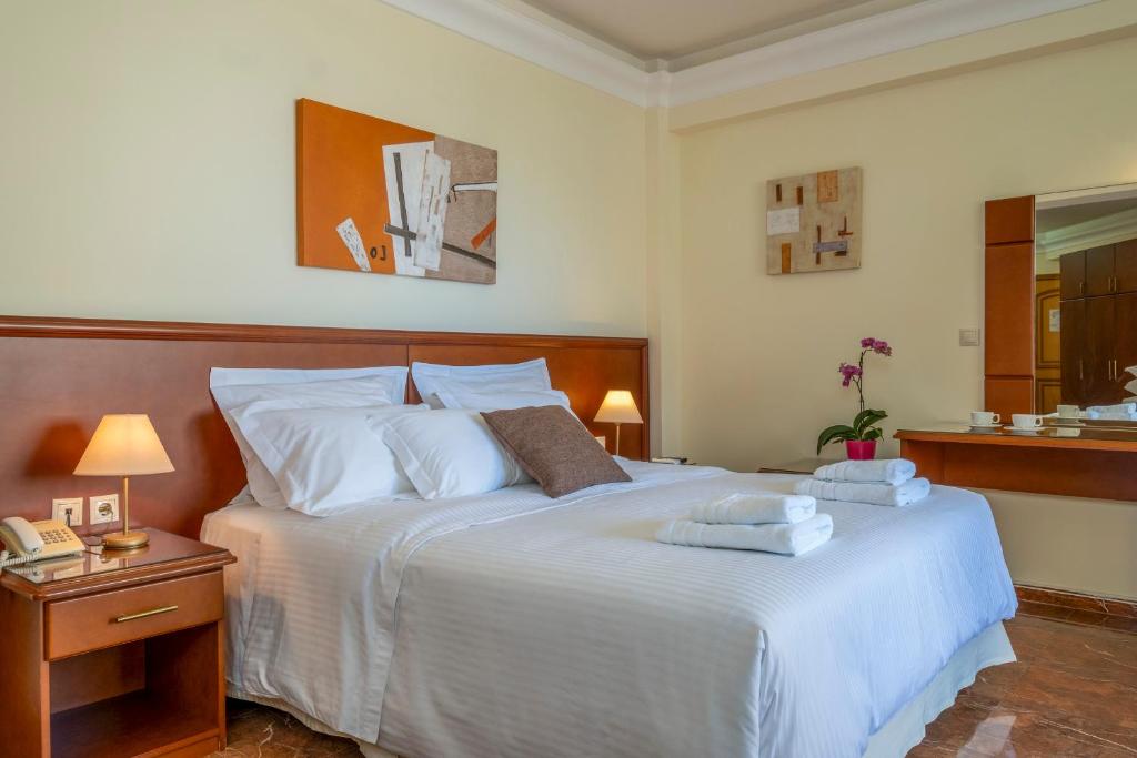 Postel nebo postele na pokoji v ubytování Porto Alegre Hotel