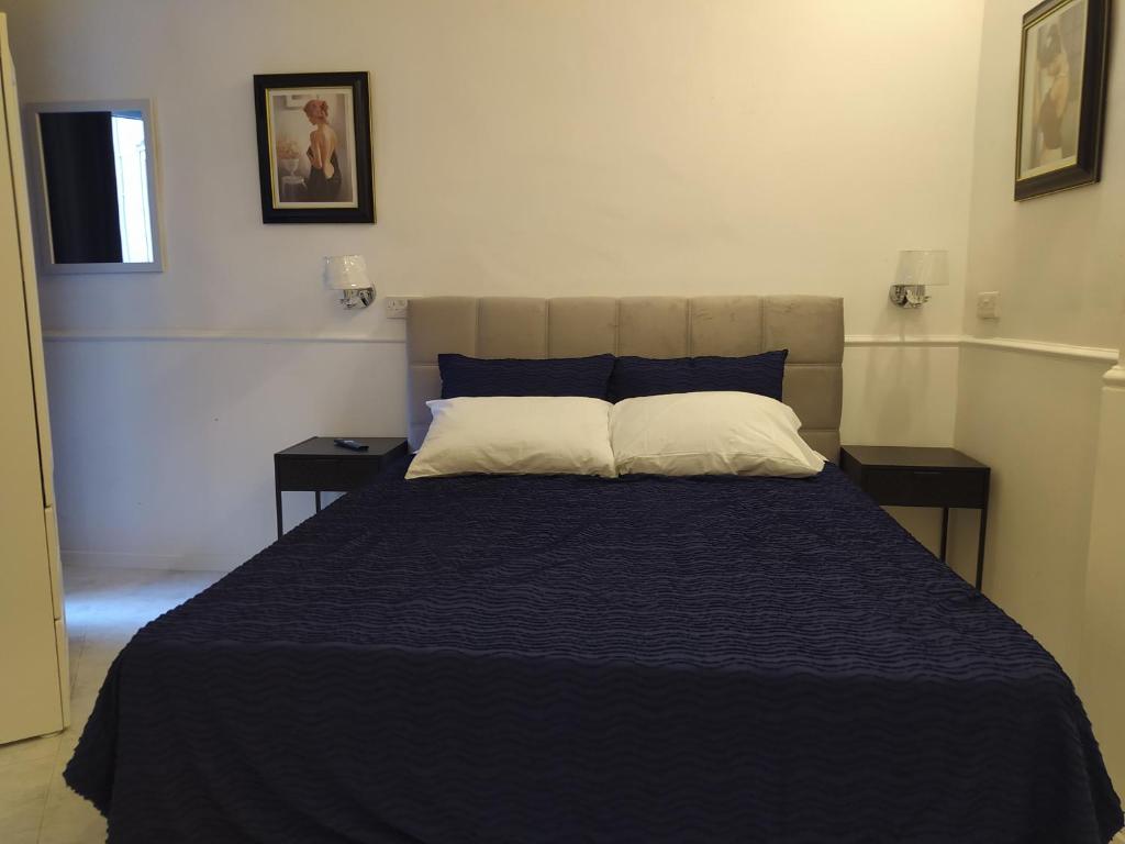Postel nebo postele na pokoji v ubytování 3 Cities Heart 2