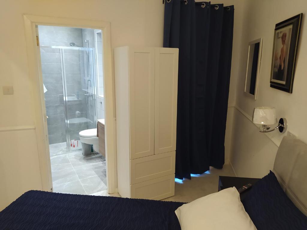 Postel nebo postele na pokoji v ubytování 3 Cities Heart 2