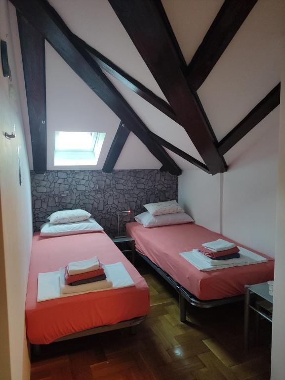 Postel nebo postele na pokoji v ubytování Apartman Sunrise