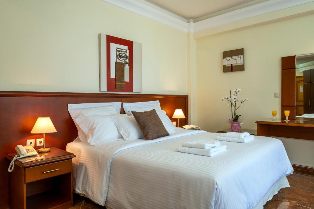 Postel nebo postele na pokoji v ubytování Porto Alegre Hotel