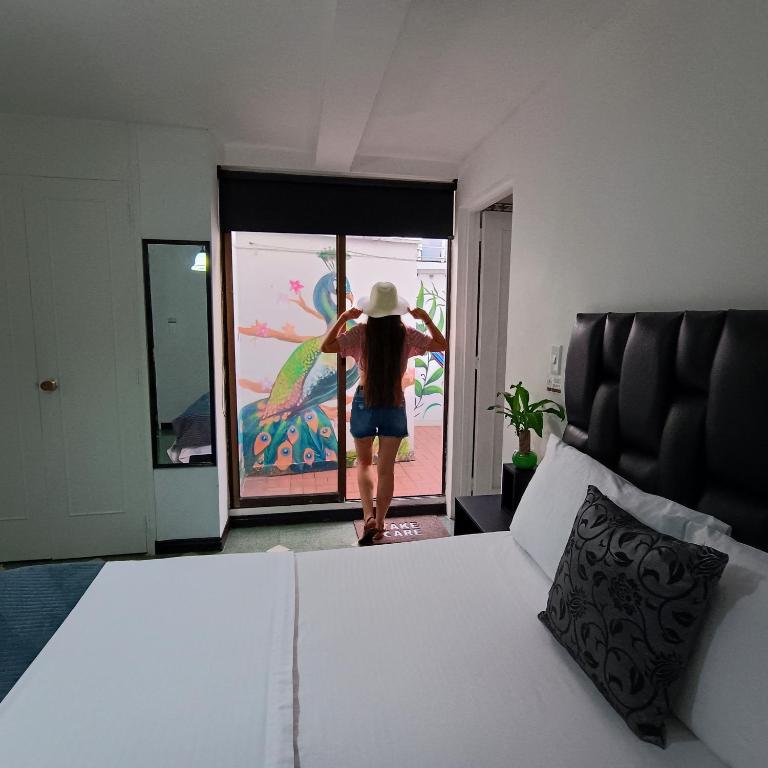 Postel nebo postele na pokoji v ubytování Moradia Laureles Medellin