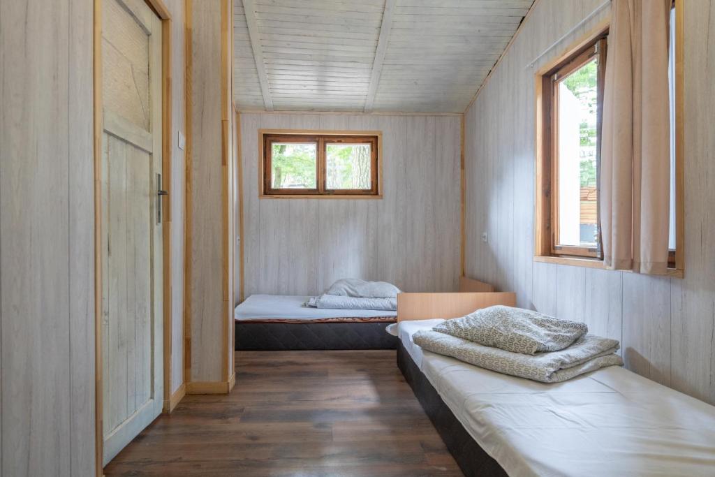 Postel nebo postele na pokoji v ubytování Ow Oliwia