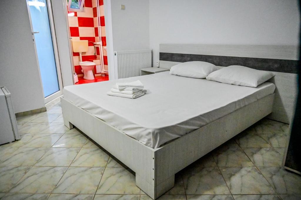 Postel nebo postele na pokoji v ubytování Hotel OBELISC