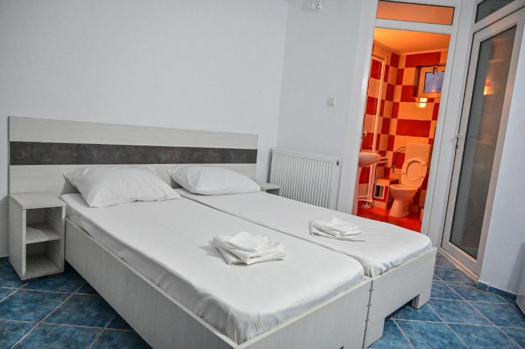 Postel nebo postele na pokoji v ubytování Hotel OBELISC