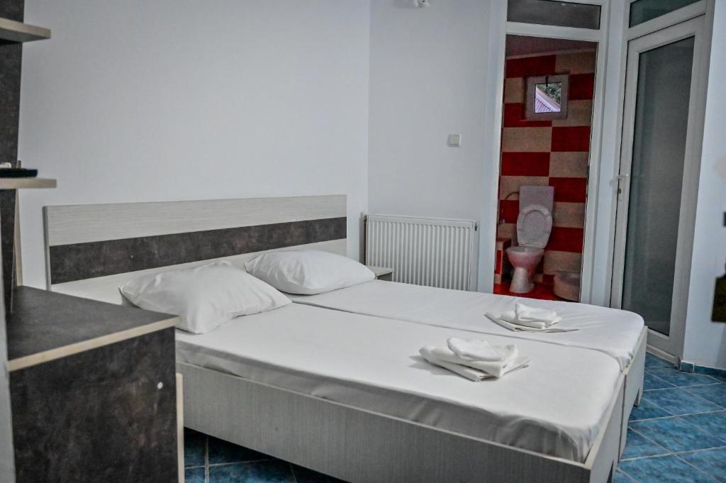 Postel nebo postele na pokoji v ubytování Hotel OBELISC