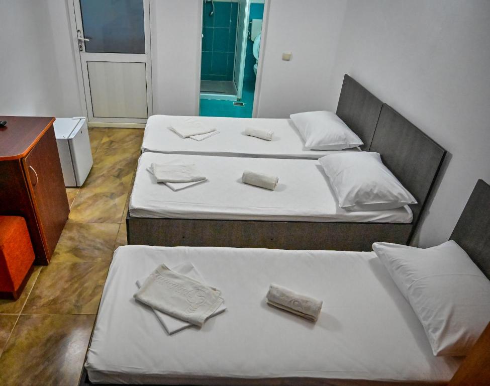 Postel nebo postele na pokoji v ubytování Hotel OBELISC