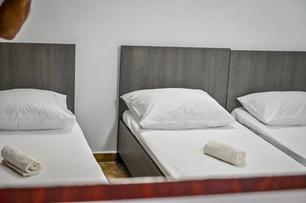 Postel nebo postele na pokoji v ubytování Hotel OBELISC