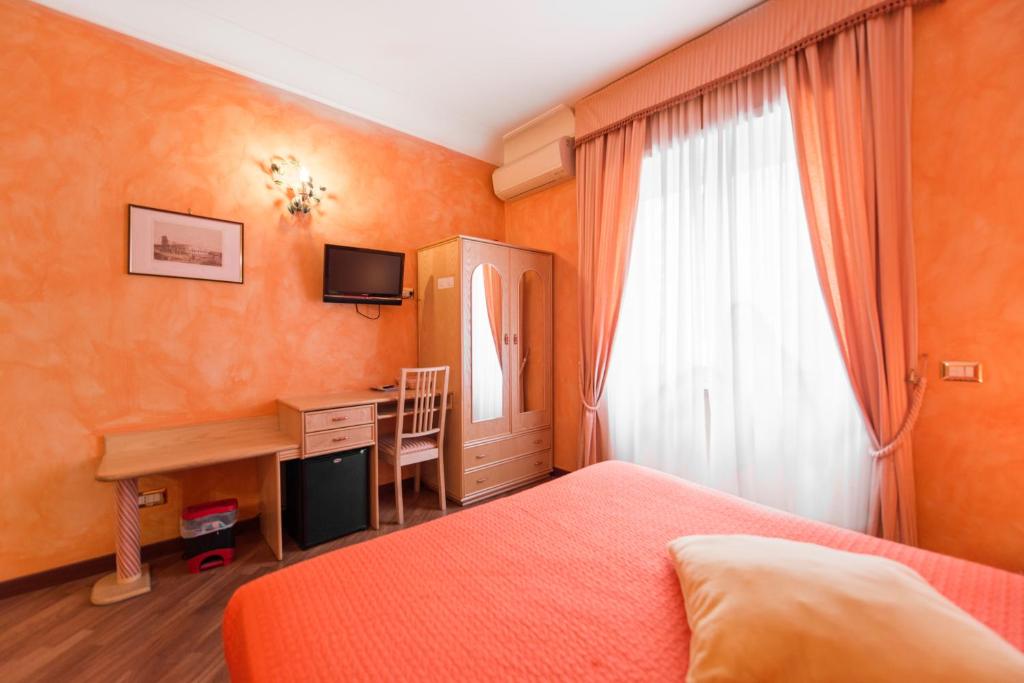 Posteľ alebo postele v izbe v ubytovaní Rifugio Di Roma