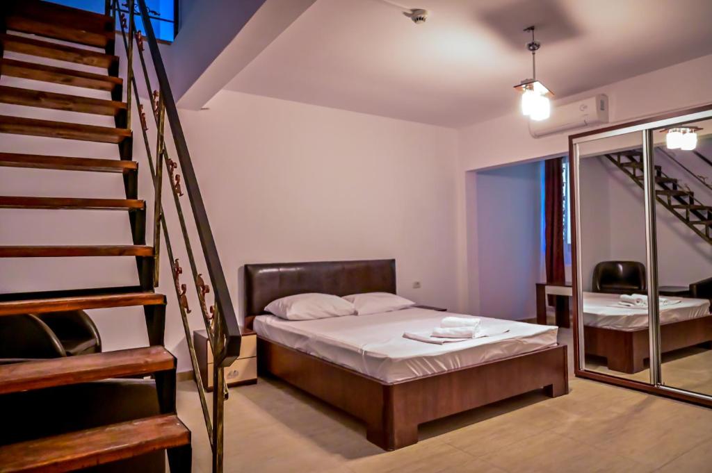 Postel nebo postele na pokoji v ubytování Hotel OBELISC