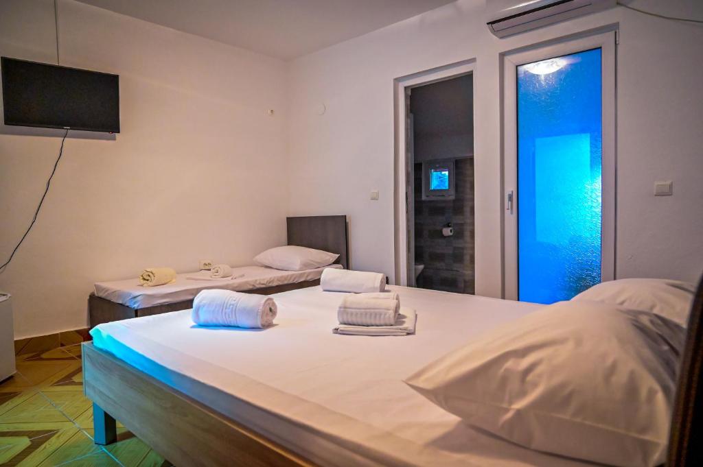 Postel nebo postele na pokoji v ubytování Hotel OBELISC
