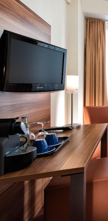 TV a/nebo společenská místnost v ubytování Best Western Hotel Braunschweig Seminarius
