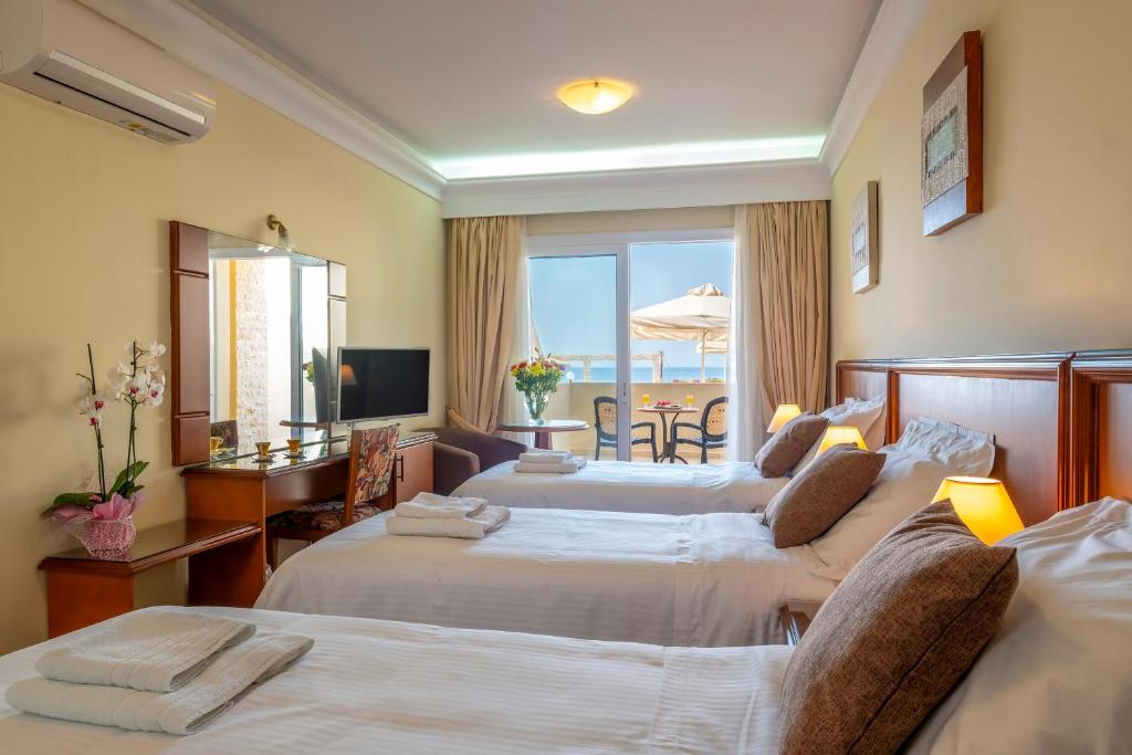 Postel nebo postele na pokoji v ubytování Porto Alegre Hotel