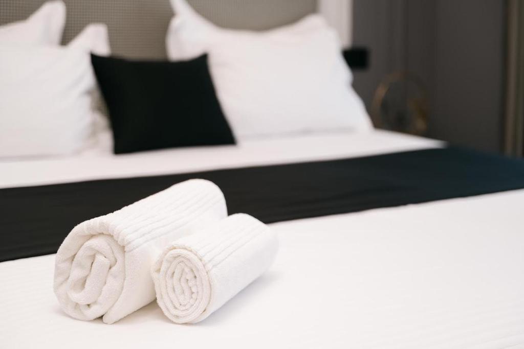 Postel nebo postele na pokoji v ubytování Hotel Teuta
