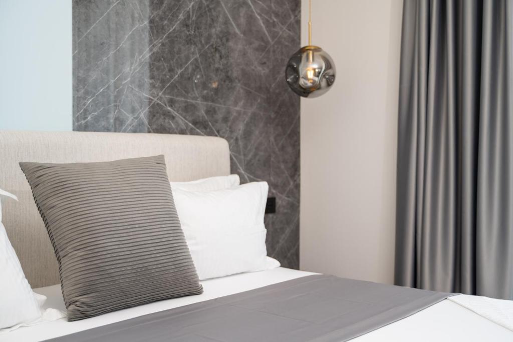 Postel nebo postele na pokoji v ubytování Hotel Teuta
