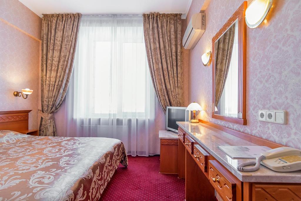 Postel nebo postele na pokoji v ubytování Ukraine Hotel