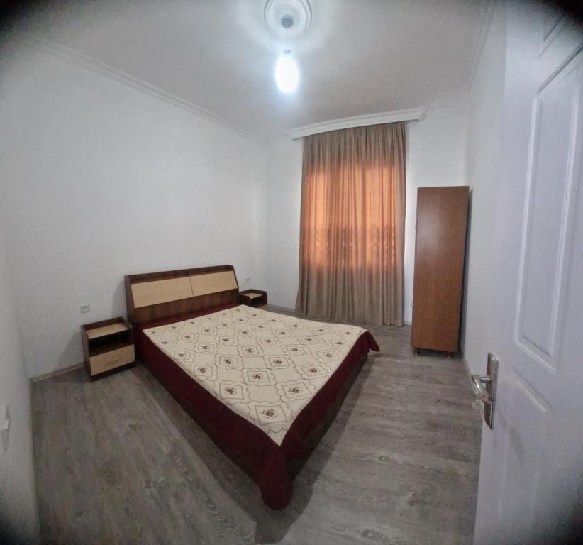 Una cama o camas en una habitación de Guesthome Achi